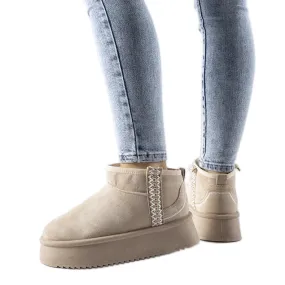 Bottes de neige beiges sur la plateforme Scavi