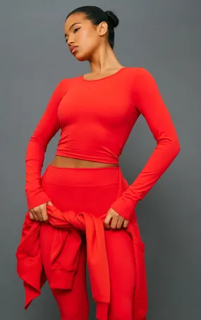 Crop top manches longues en sculpt rouge tomate à détail contours