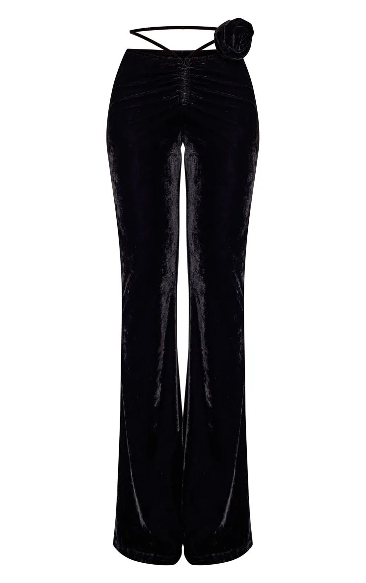 Pantalon flare en velours noir à rosace froncé devant