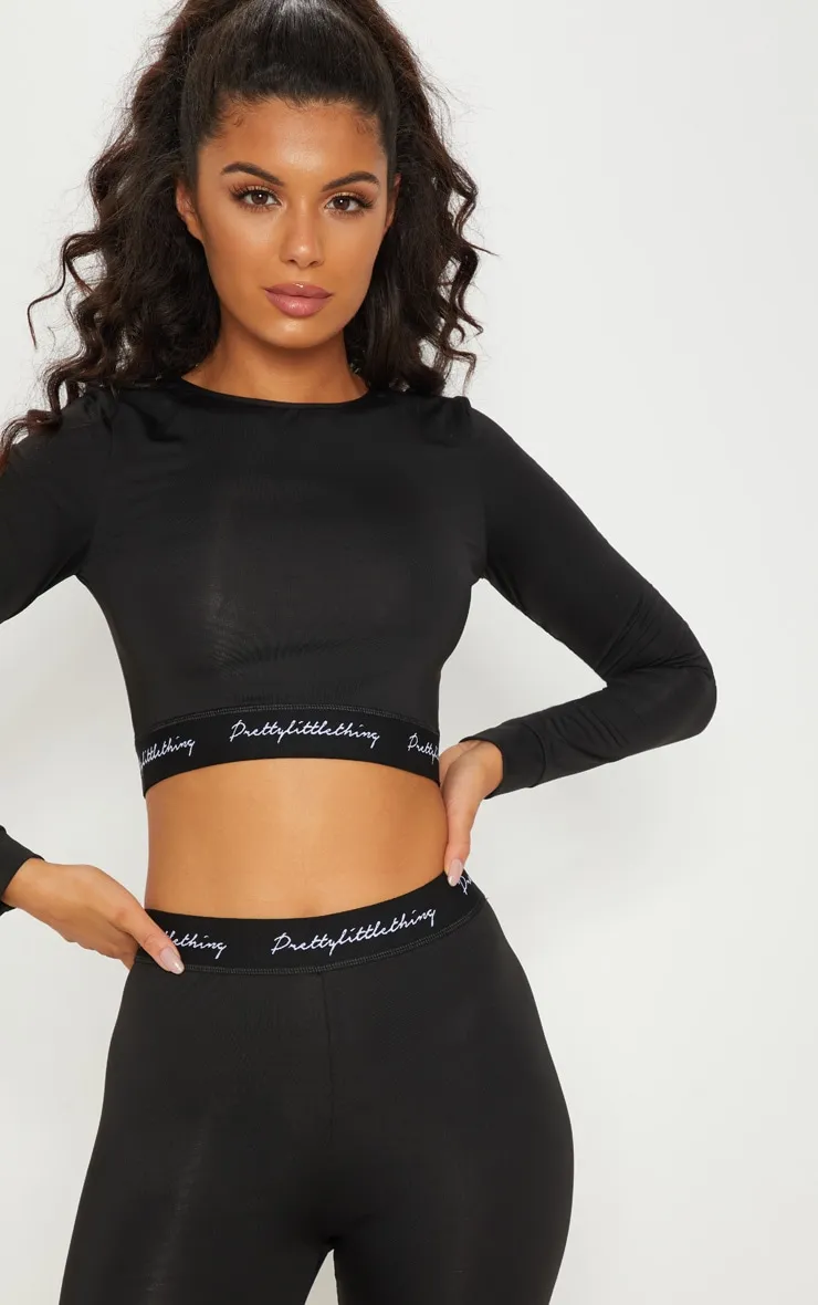 PRETTYLITTLETHING Sport - Crop top manches longues noir à bande élastique PRETTYLITTLETHING