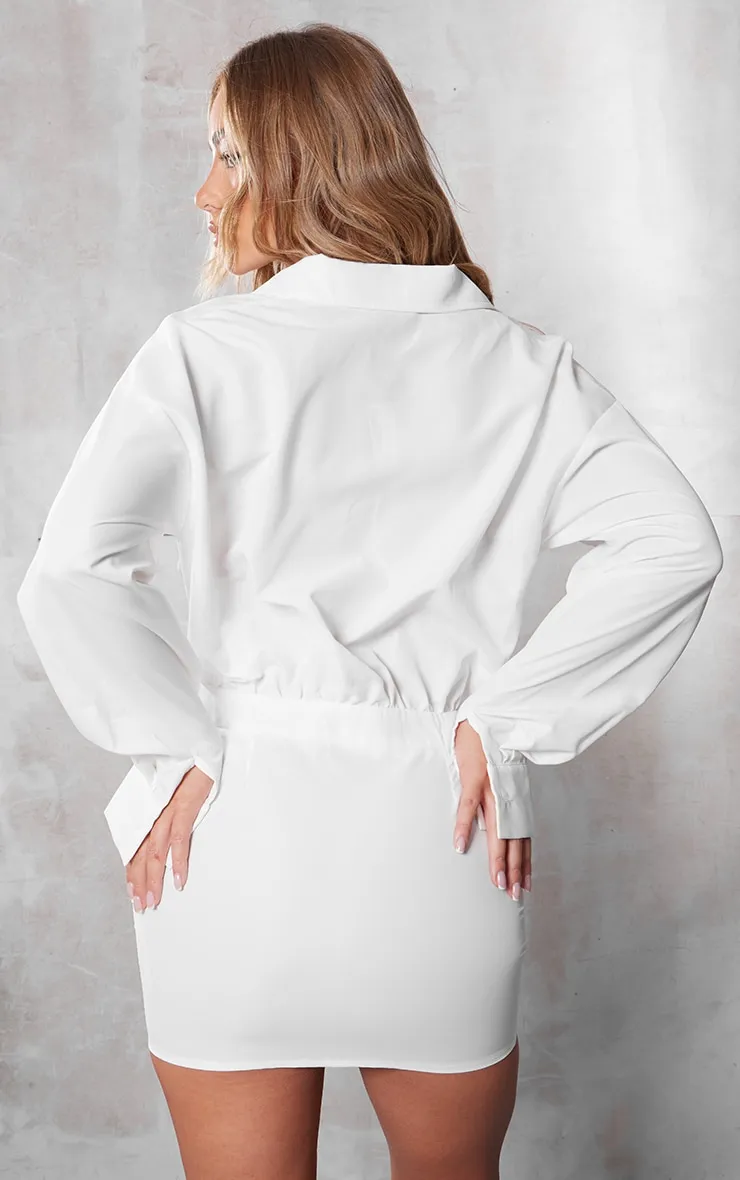 Robe chemise blanche découpée à poches et manches longues